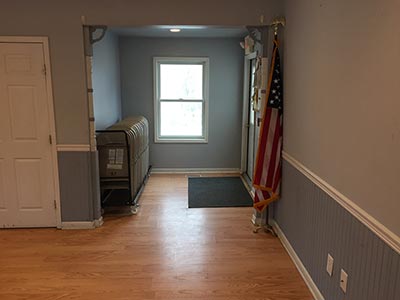 area with door to outside access, folding chairs, flag